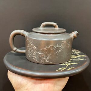 Ấm trà tử sa đức trung hỏa biến nê hưng khắc sơn thủy tinh pha trà ngon công năng tốt.