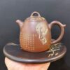 Ấm tử sa hỏa biến cao cấp họa mặt phật thủ công cực đẹp pha trà càng pha càng ngon.