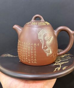 Ấm tử sa hỏa biến cao cấp họa mặt phật thủ công cực đẹp pha trà càng pha càng ngon.