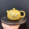 Ấm tử sa nê hưng tây thi khắc nàng tiên cá màu vàng đẹp 230ml pha trà ngon.