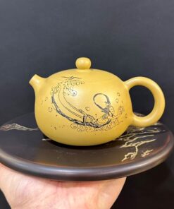 Ấm tử sa nê hưng tây thi khắc nàng tiên cá màu vàng đẹp 230ml pha trà ngon.